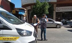 Dükkanının kepengine 'hasım' yazan kişiyi tabancayla bacağından vurdu